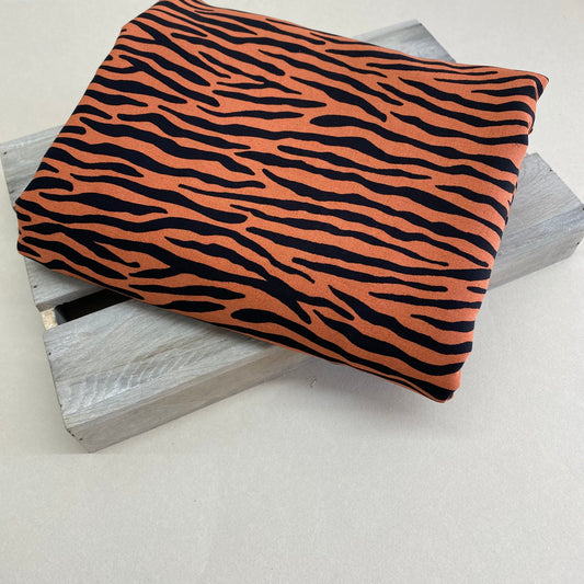 Radiance Zebra Stripe Viscose Dress Fabric Tangerine Dream 3.35m